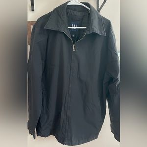 This is a black nylon zip up cot from GAP size large.